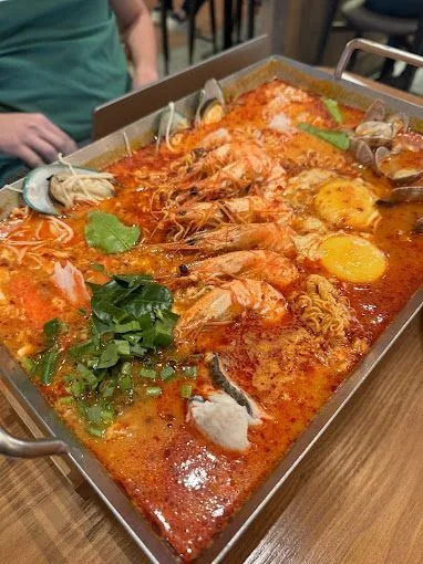 Thai Super Bowl tom yum hotpot, bubbling with river prawns and egg yolks